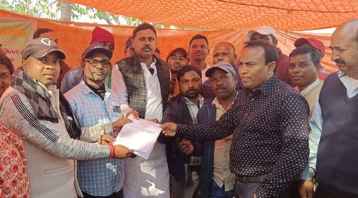 Panchayat representative giving memorandum to BDO